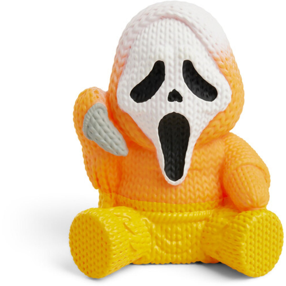 Knitted candy-corn ghost figure with black face and folded arms