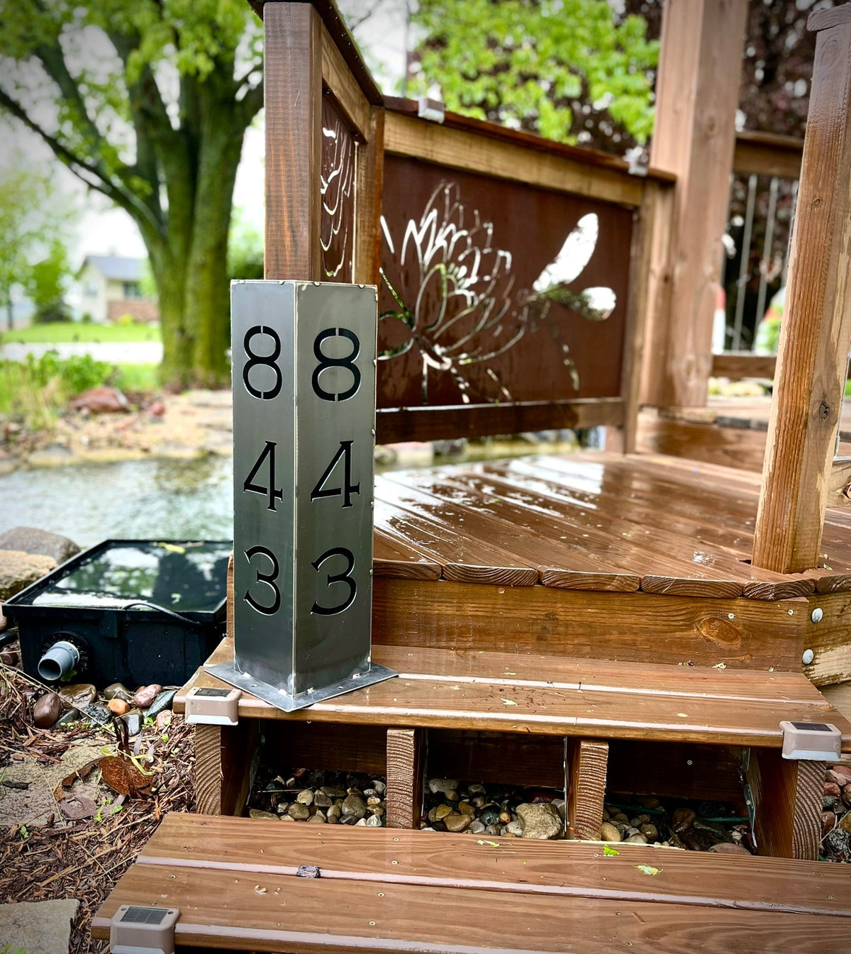 Solar address pillar light in steel with numbers 0, 8, 4, 3 and 4 shown