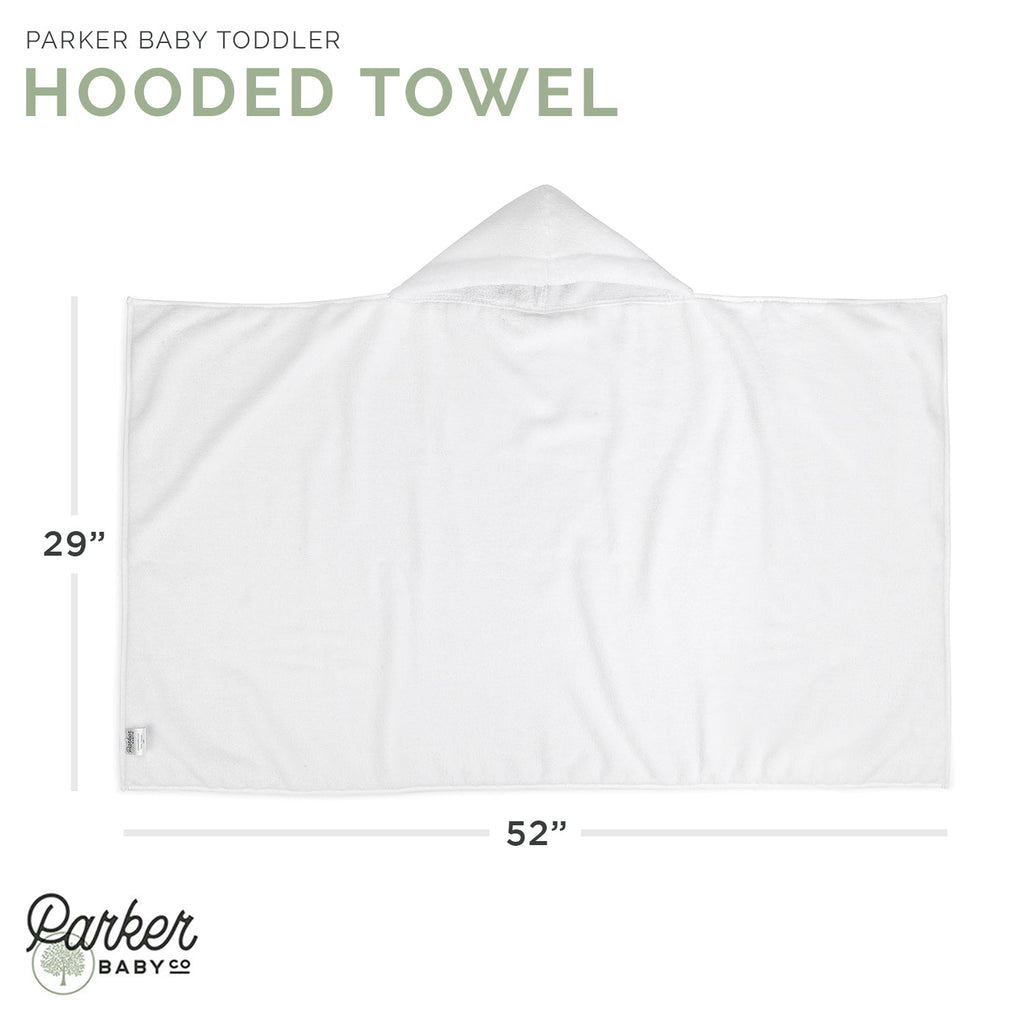 White hooded bath towel laid flat with centered hood and side label