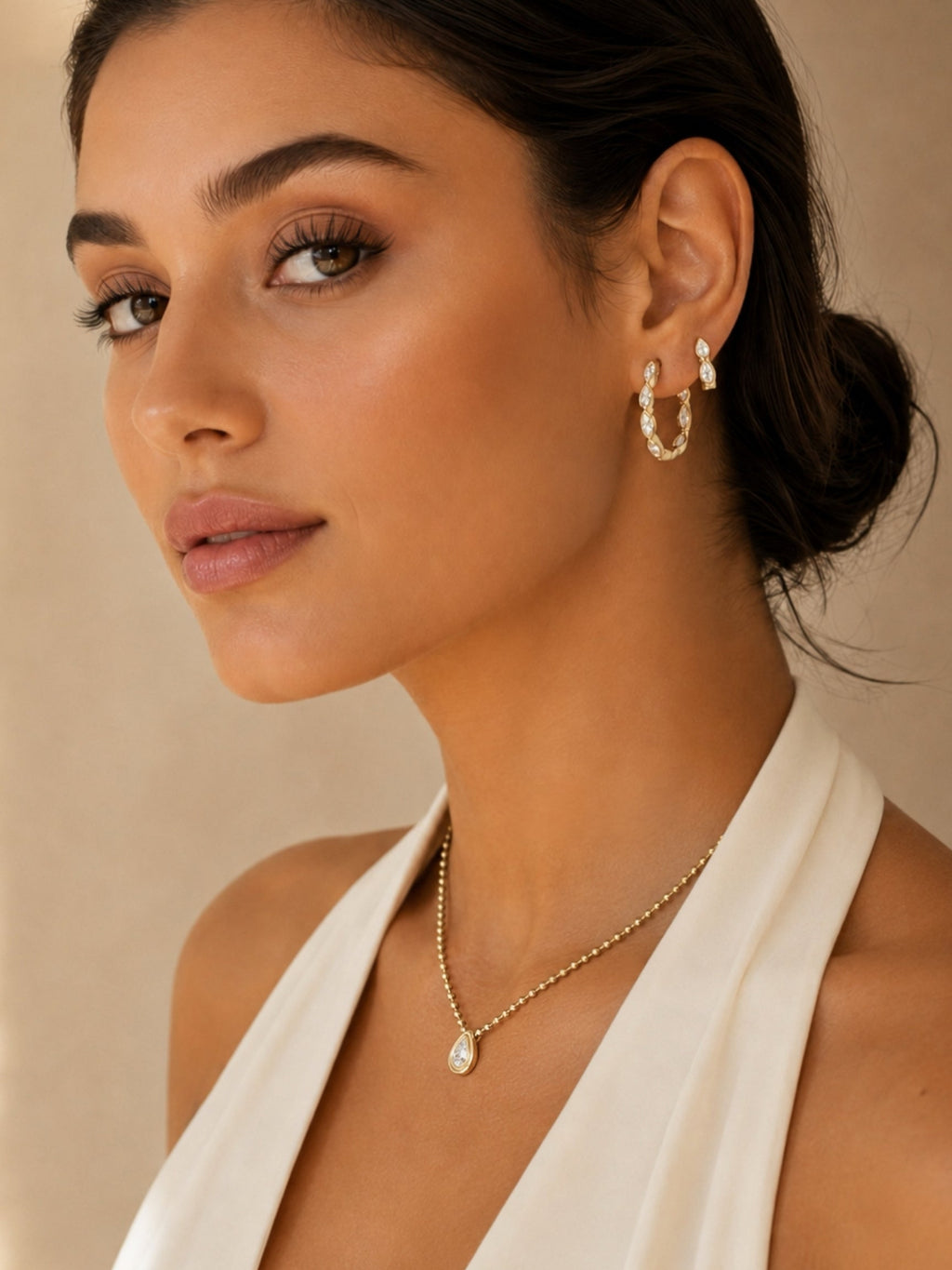 Small marquise hoop earrings with pavé stones on a model