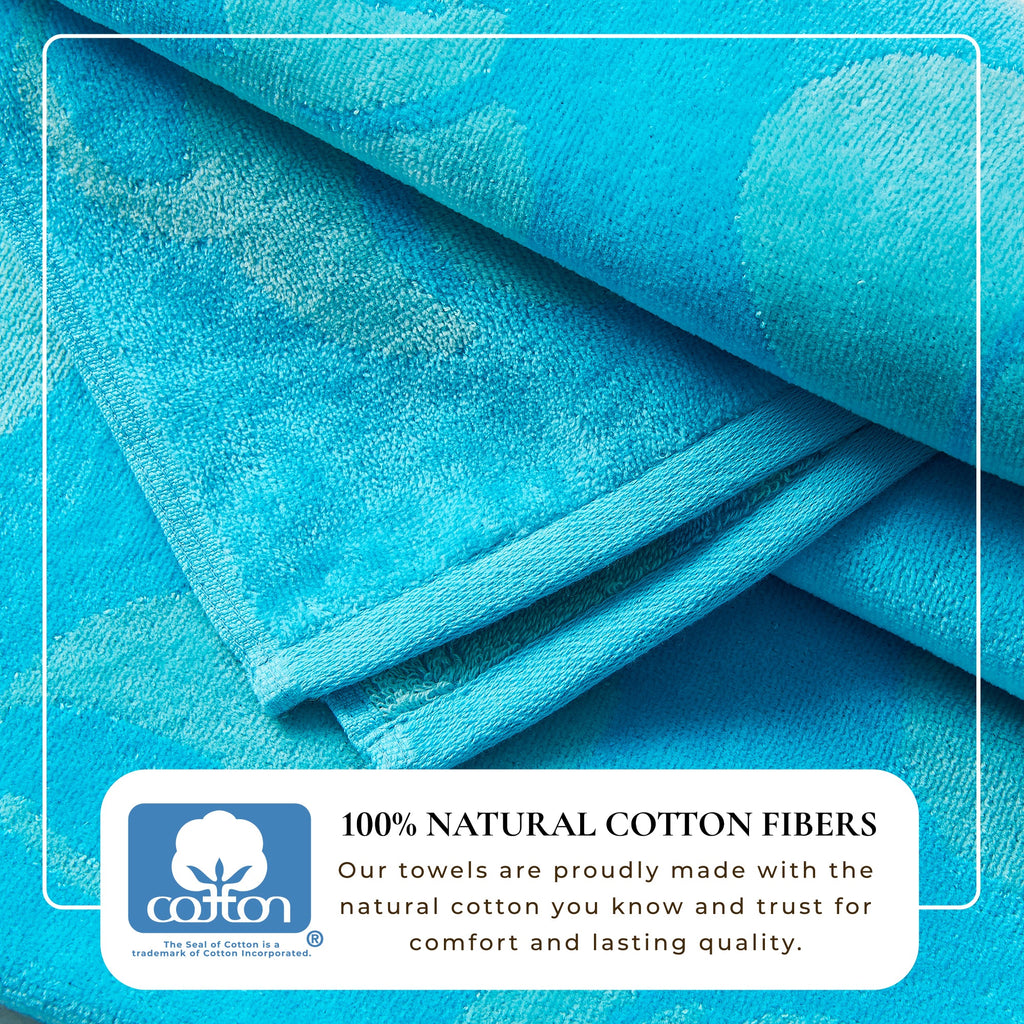 Turquoise cotton velour beach towel, folded with plush textured weave