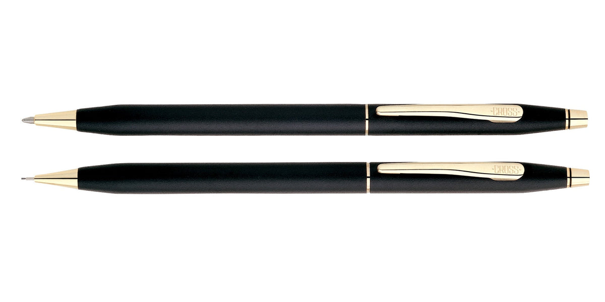 Black pen and pencil set with gold bands and pointed tips