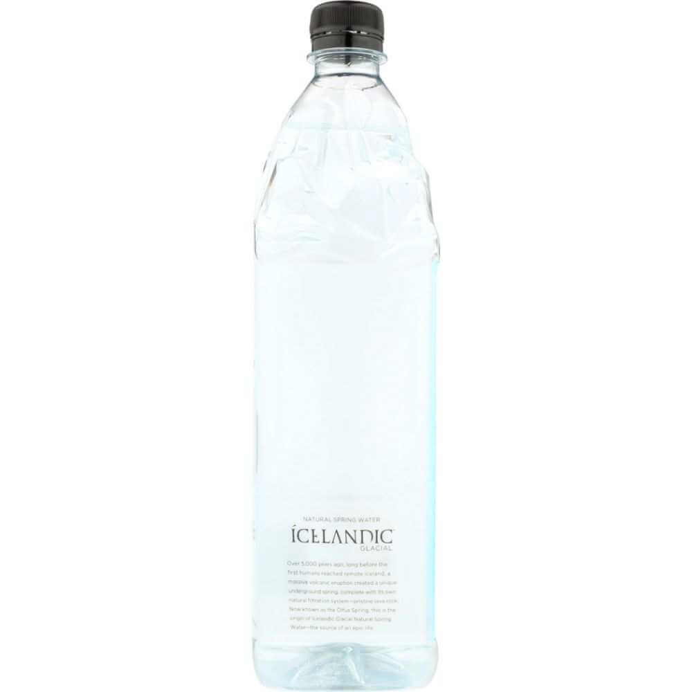 Natural spring water bottle with black cap, front label text