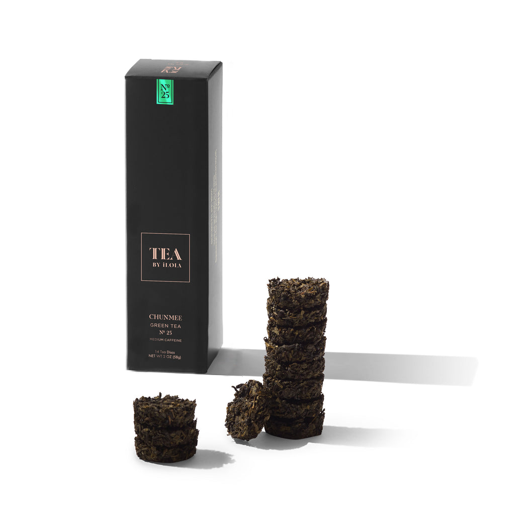 Chunmee green tea discs beside a black tea box