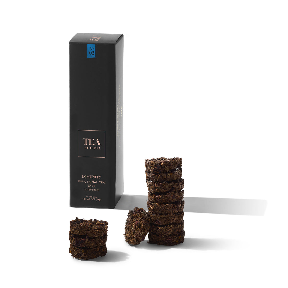 Immunity tea discs arranged beside a black tea box