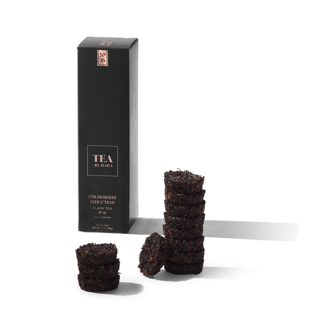 Strawberry Seduction black tea box with several compressed loose-leaf tea discs