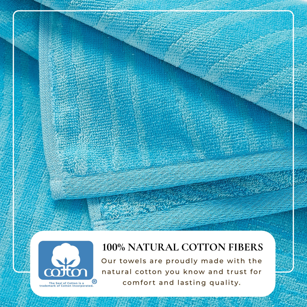 Blue cotton velour beach towel with dense looped texture, folded layers