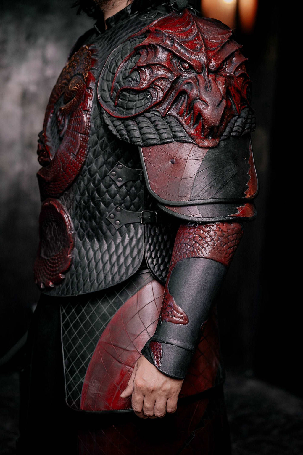 Vampire knight armor costume with quilted gray tunic, red underlayer, and armored gauntlets