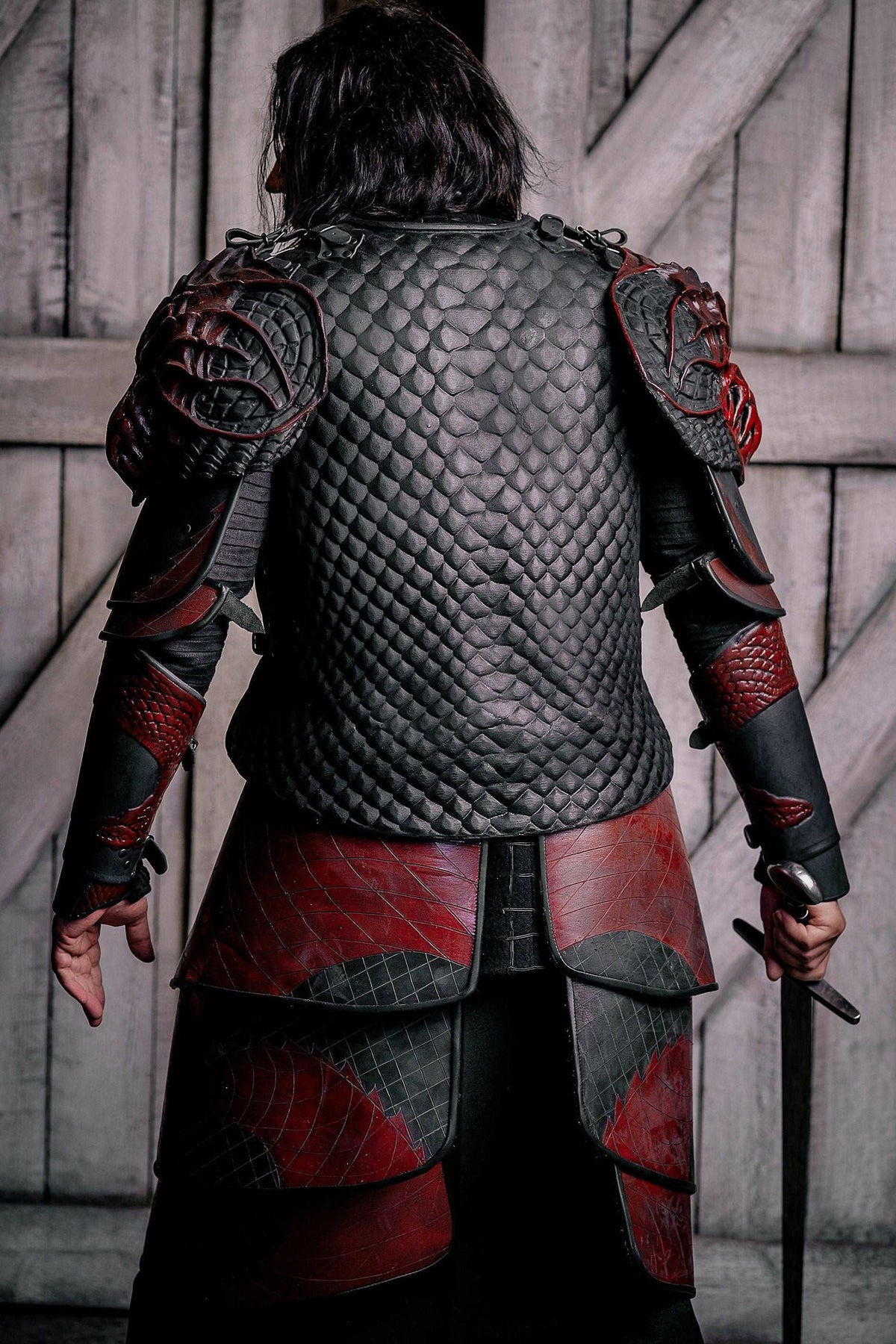 Back view vampire knight armor costume with gray scale cuirass and red paneling