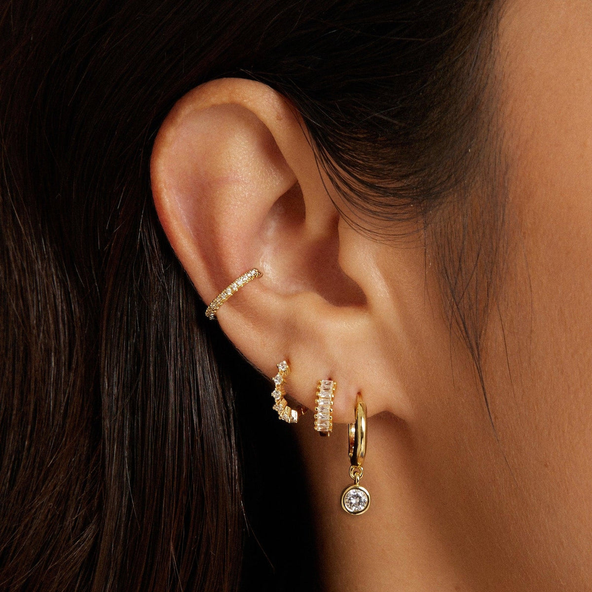 Gold-tone cluster diamond hoop earrings with round drop pendant