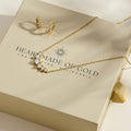 Gold-tone cluster diamond necklace with matching hoop earrings