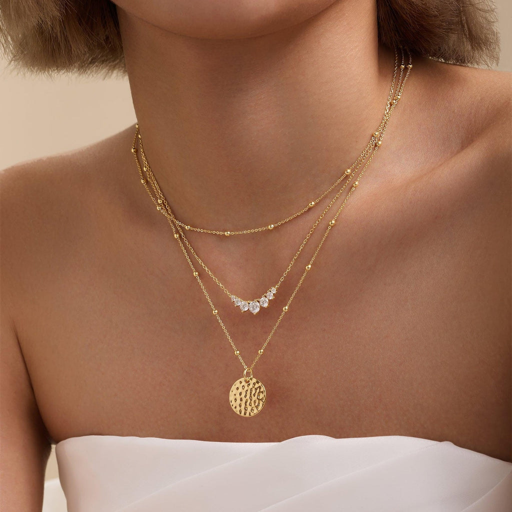 Gold-tone layered cluster diamond necklaces with round pendant