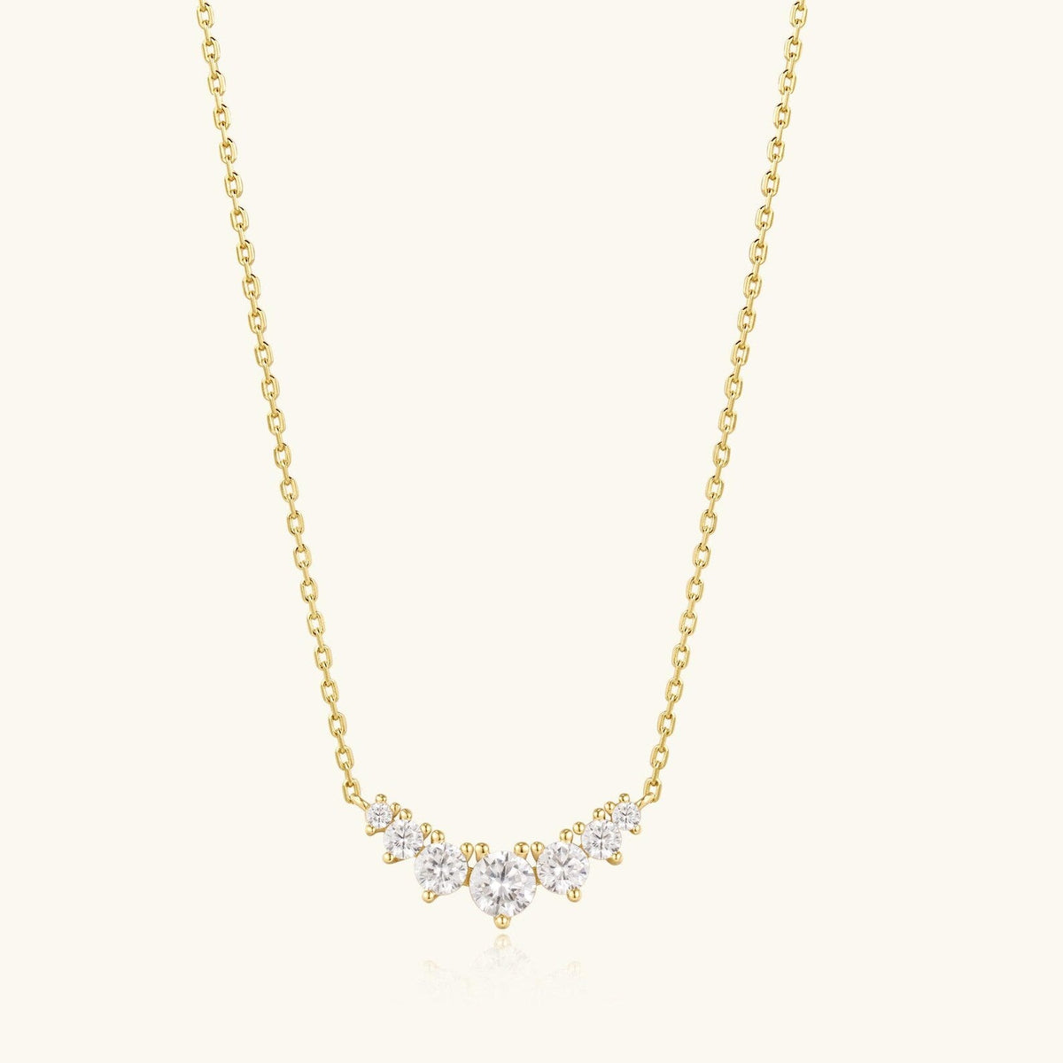 Gold-tone cluster diamond necklace with scalloped stone clusters