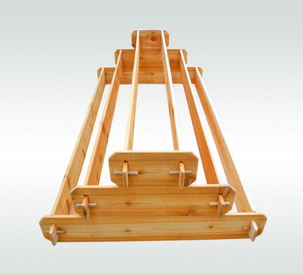 Three-tier cedar raised garden bed with open frame base and slatted side boards
