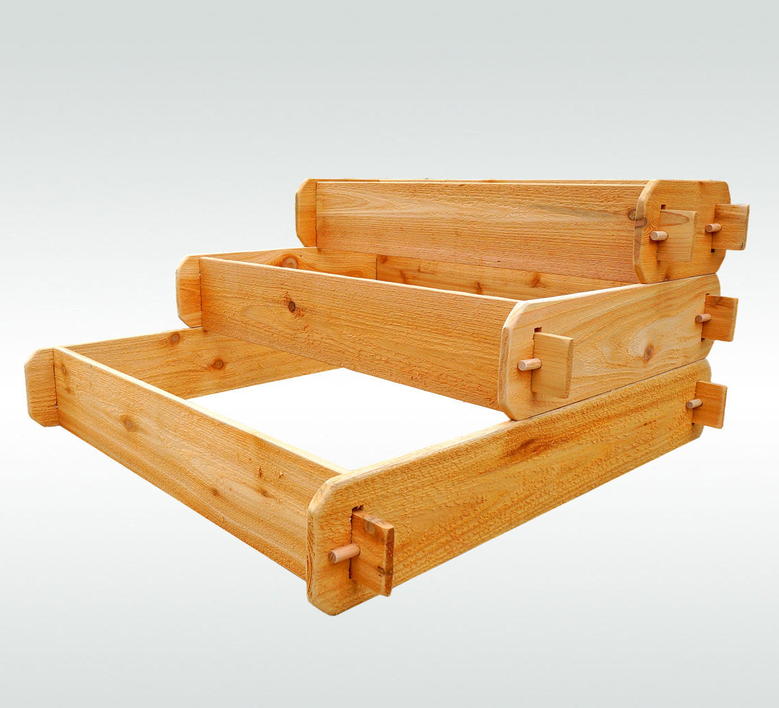 Three-tier raised cedar planter frame with open inner sections and interlocking corner pieces
