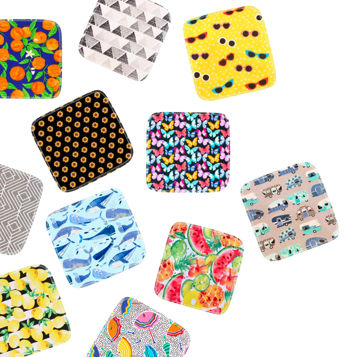 Reusable paper towels with mixed square prints, including orange hearts, blue shells, and animals
