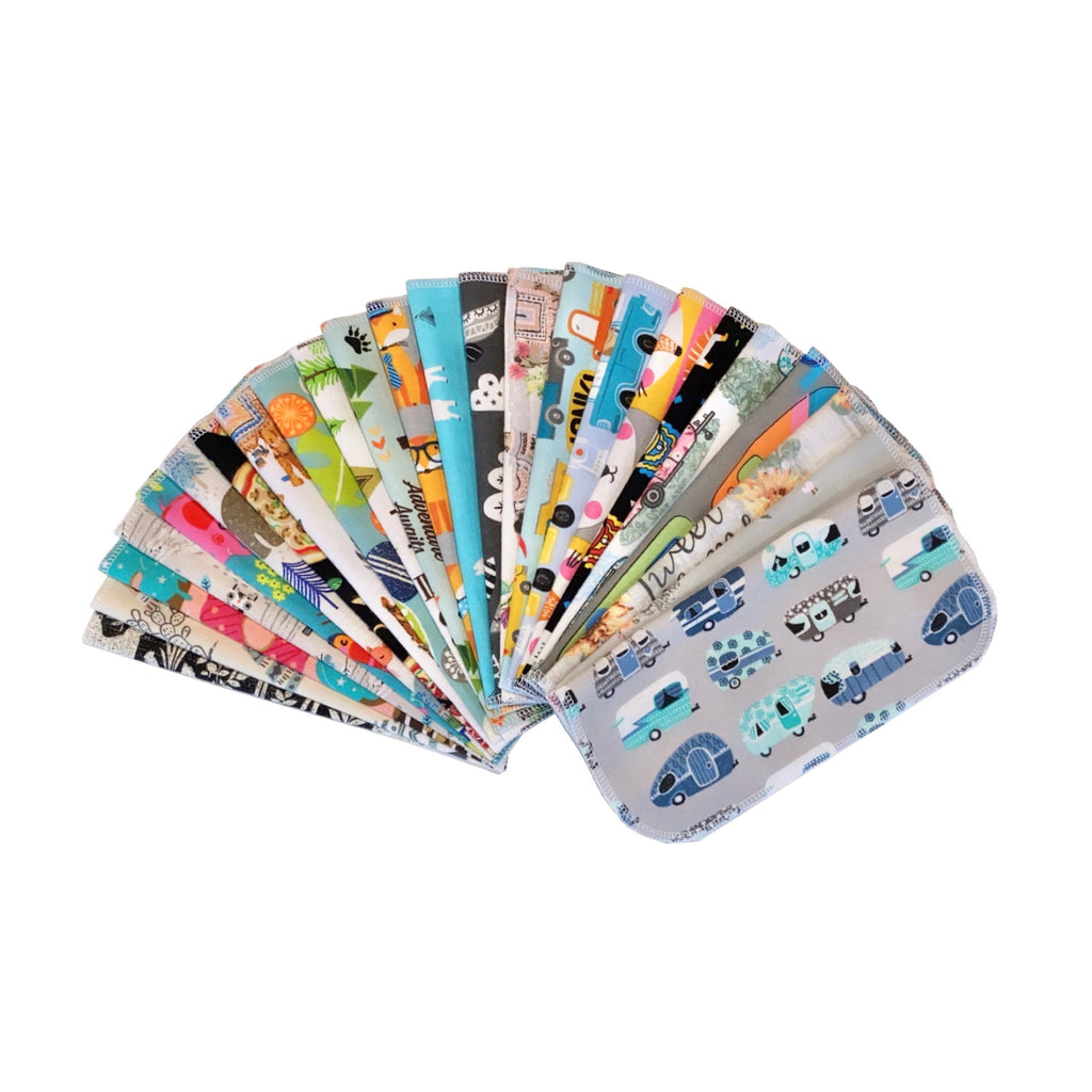 Reusable paper towels fan of folded sheets with mixed animal and scenery prints