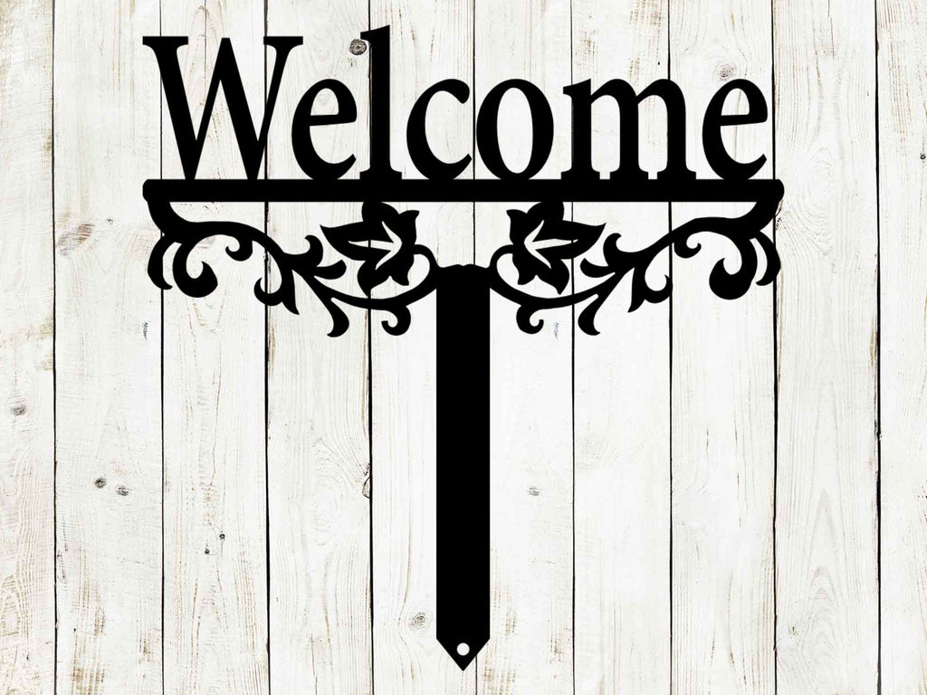 Black metal "Welcome" yard stake sign with decorative scrollwork and pointed stake