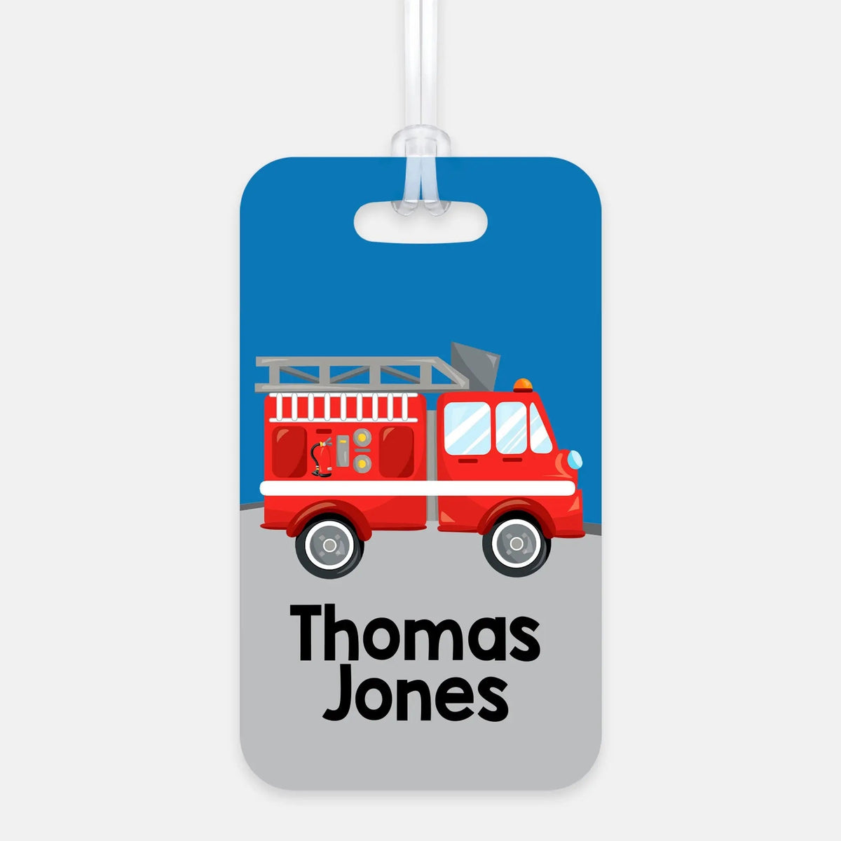 Rectangle backpack name tag with blue fire truck graphic and 'Thomas Jones' text