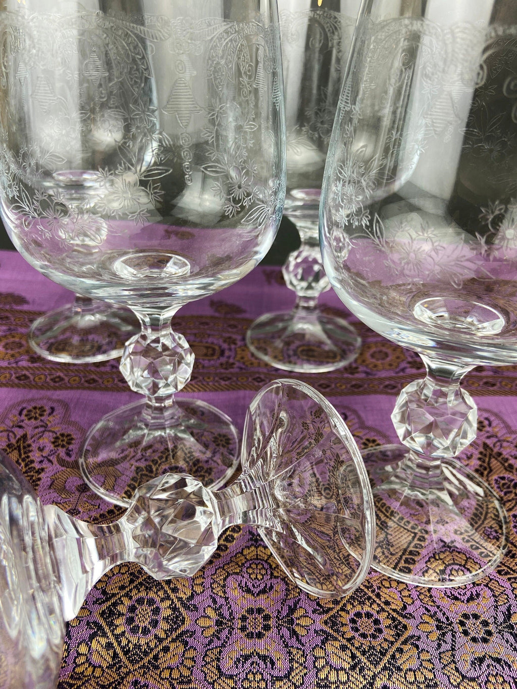 Pair of crystal goblets with lace etching and faceted clear bases
