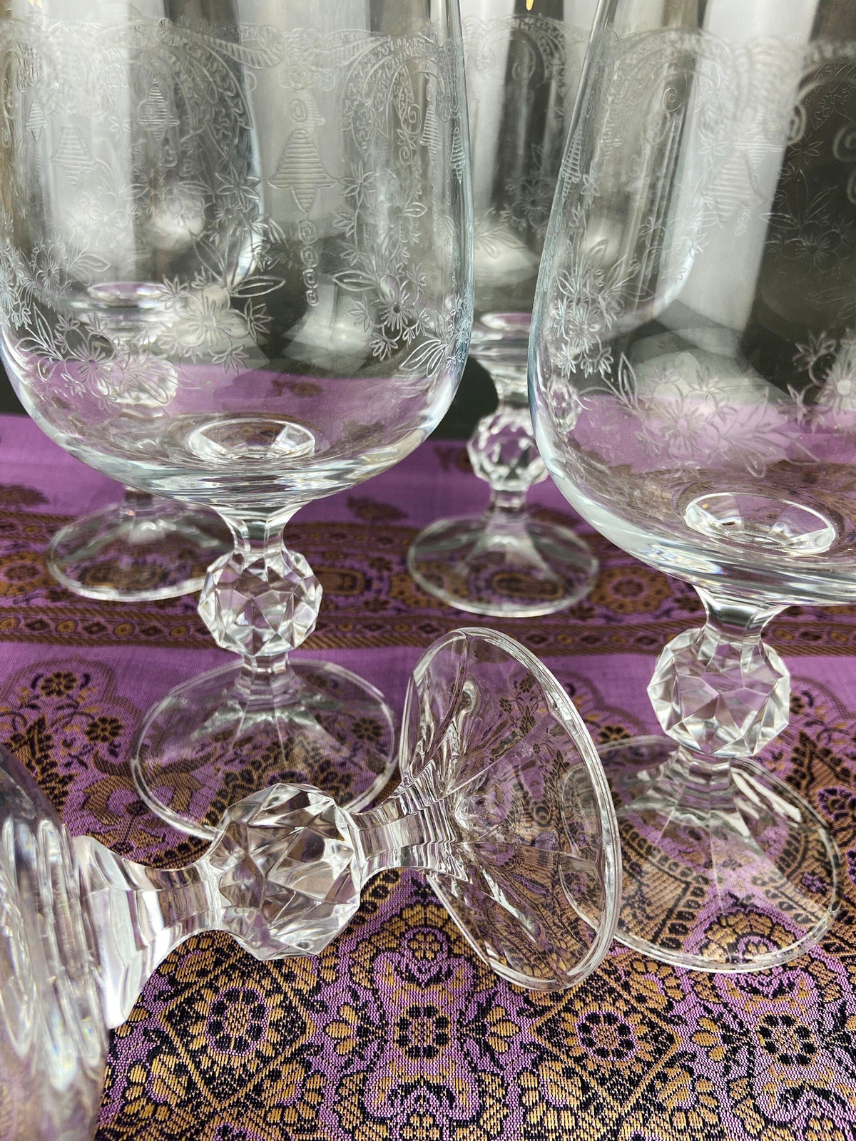 Pair of crystal goblets with lace etching and faceted clear bases