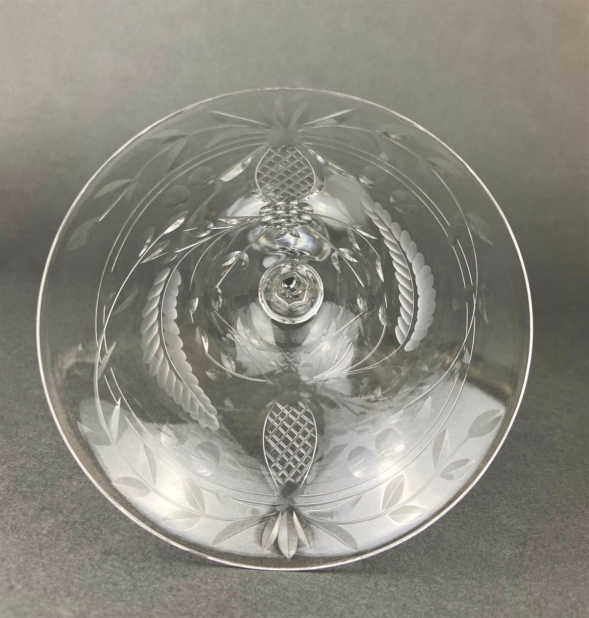 Cut crystal champagne glass bowl with etched leaf and diamond patterns