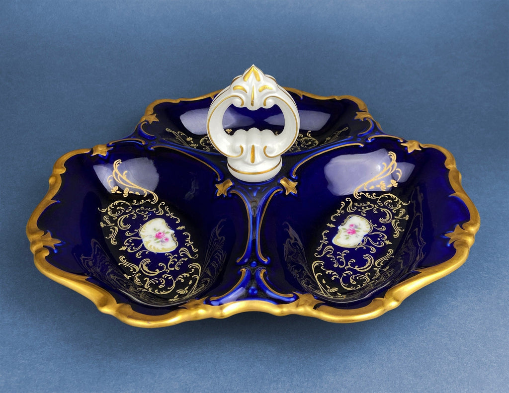 Porcelain divided bowl with handle, dark blue glaze, gold trim, floral medallions