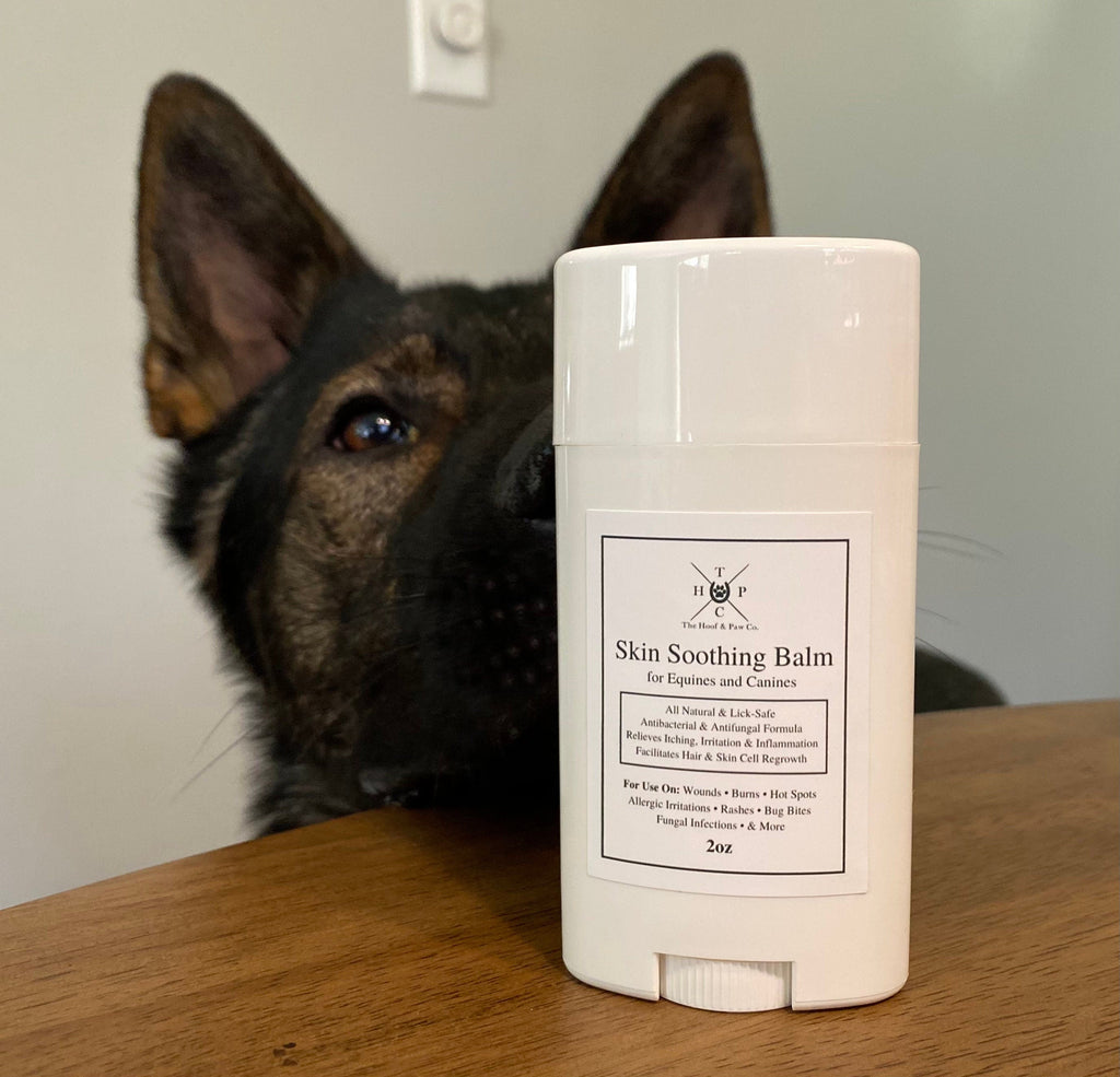 White skin soothing balm stick on tabletop with pull-up label