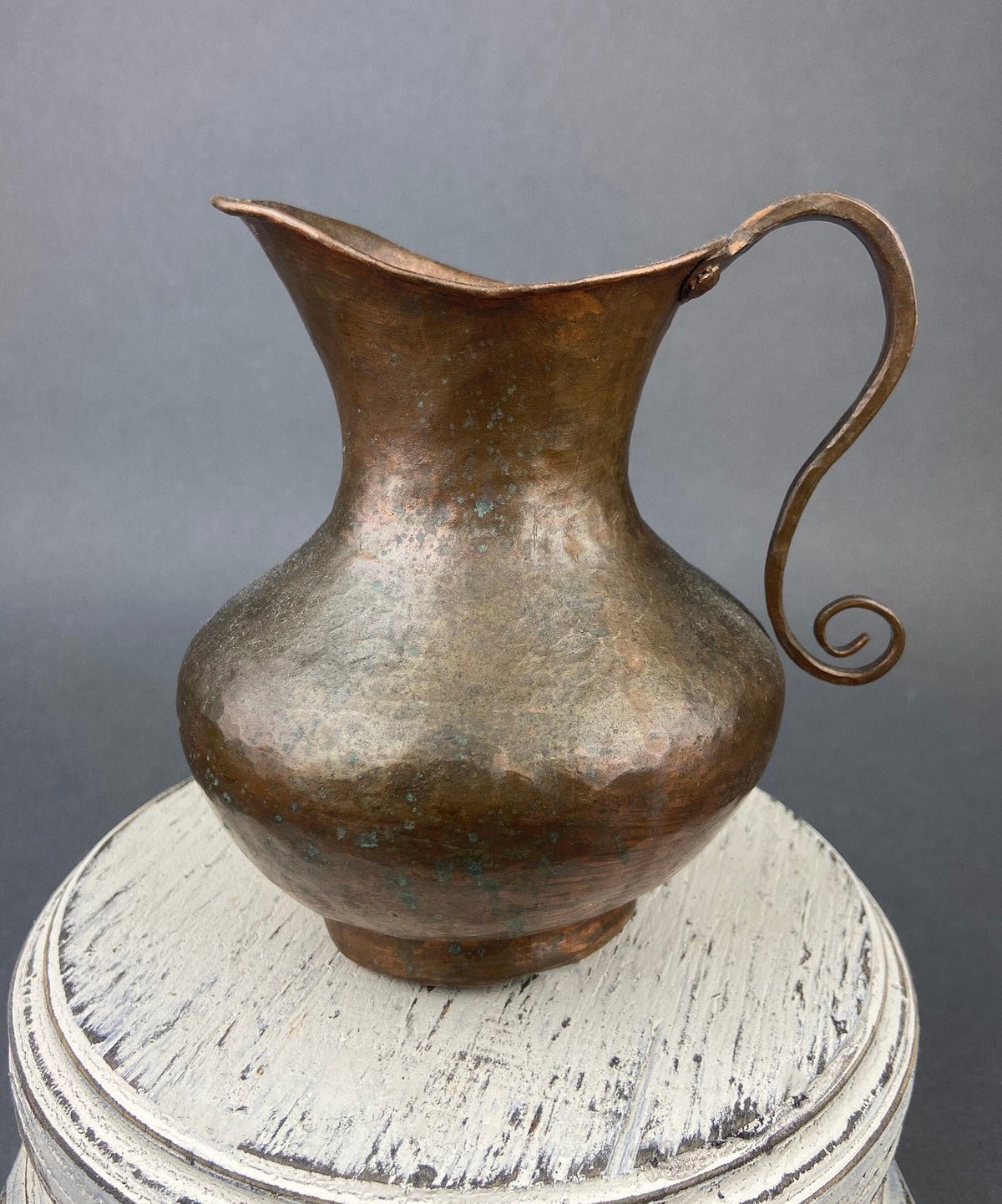Vintage hammered copper jug with swirl handle and wide spout opening