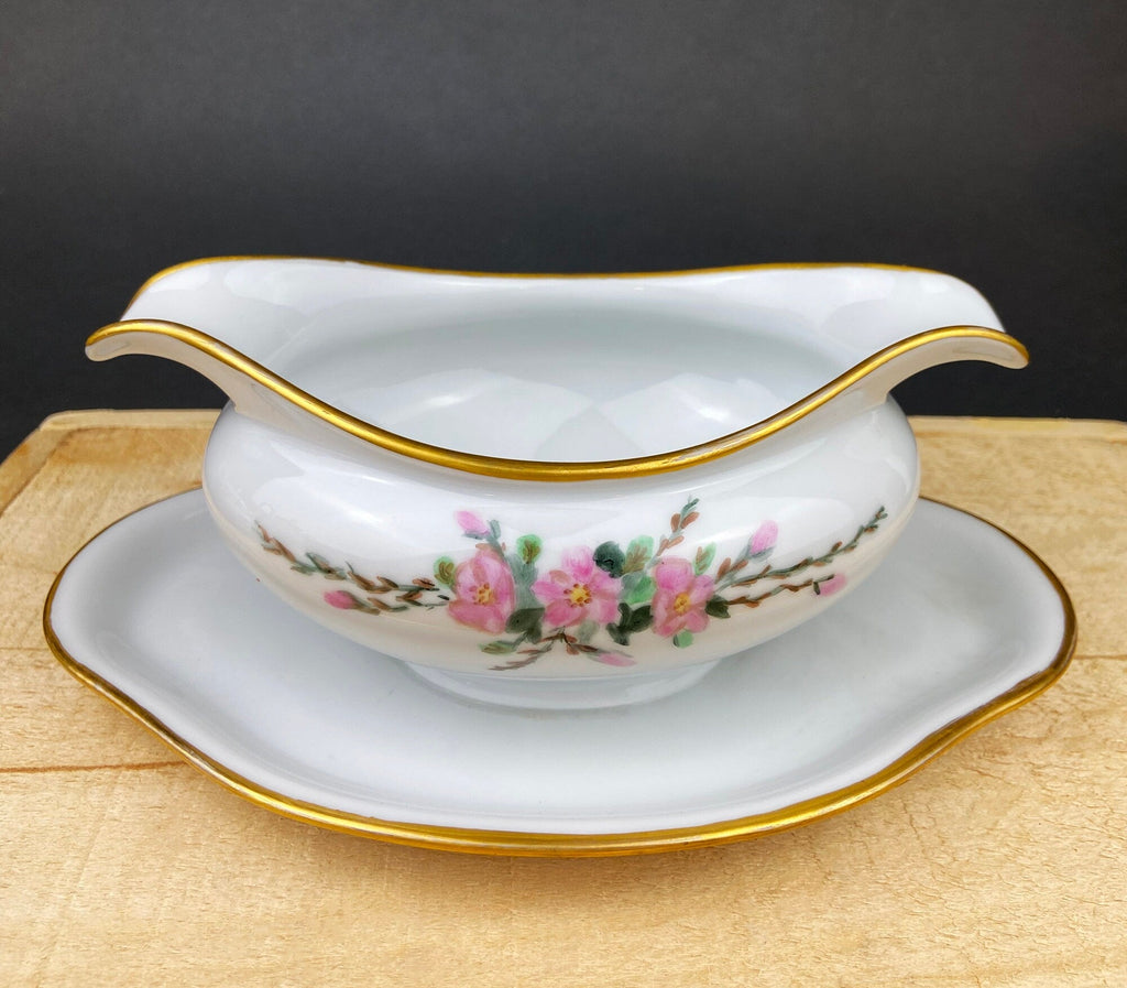 Porcelain sauce boat with gold edge and pink floral accents