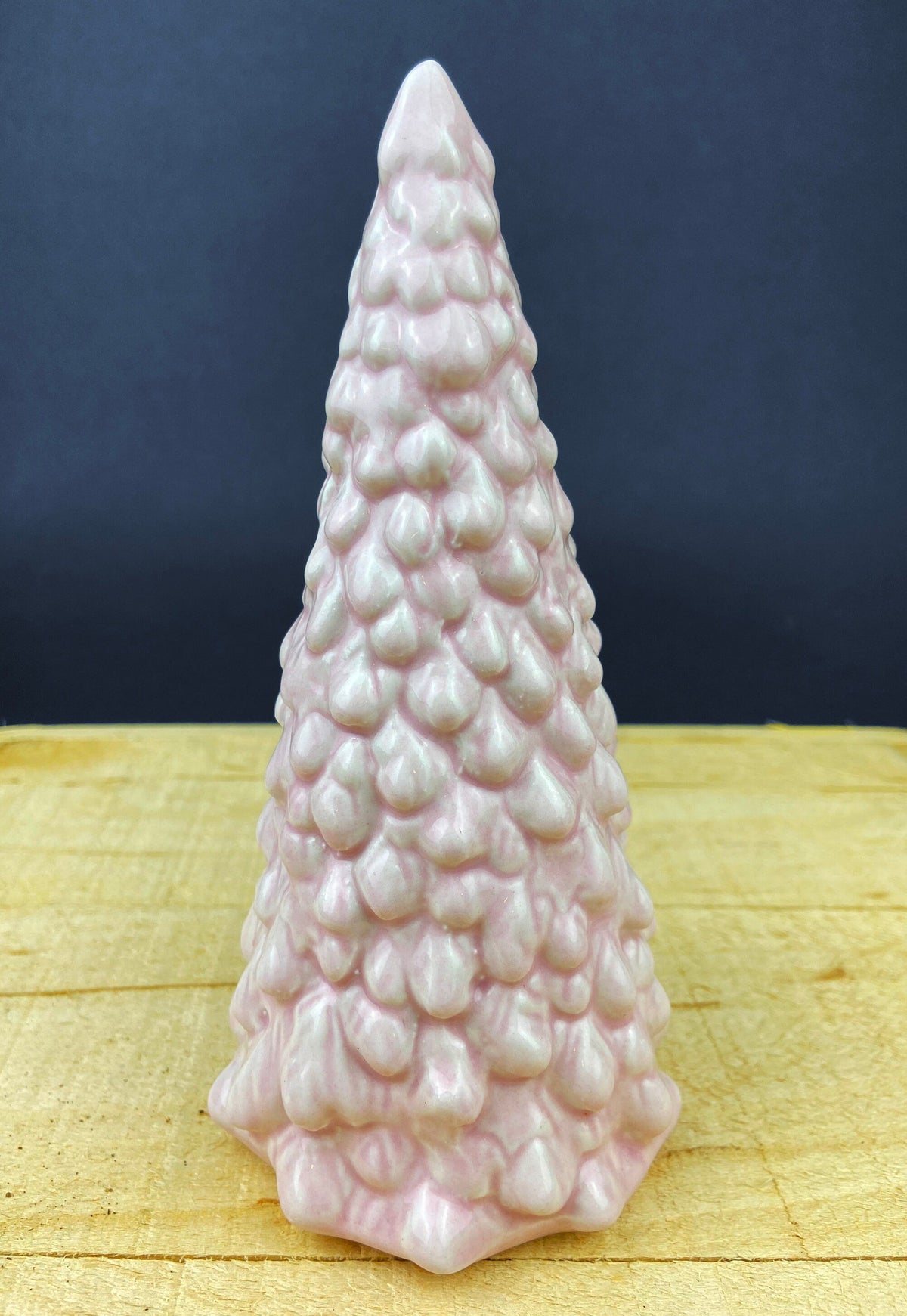 Single pink ceramic Christmas tree figurine with textured stacked bulb pattern