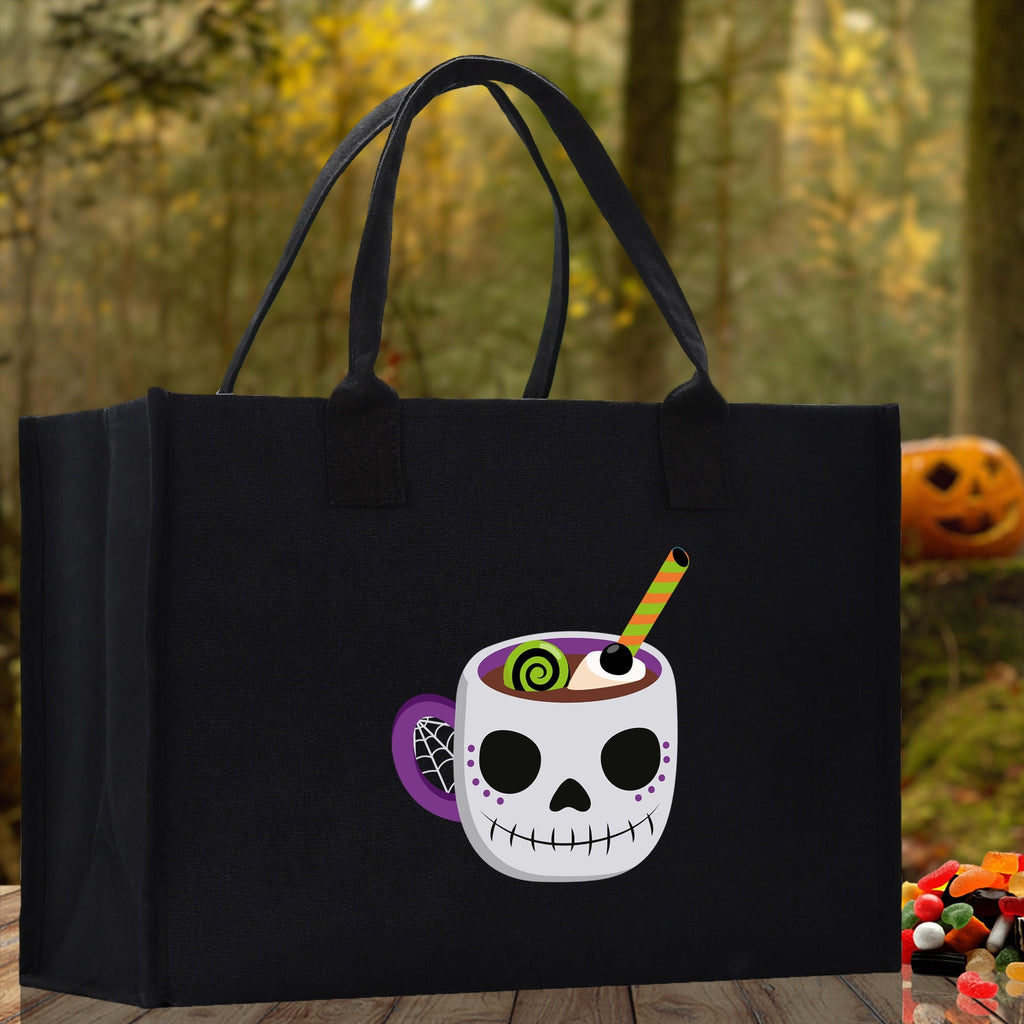 Black canvas Halloween tote bag for kids with smiling skull cup graphic and long handles