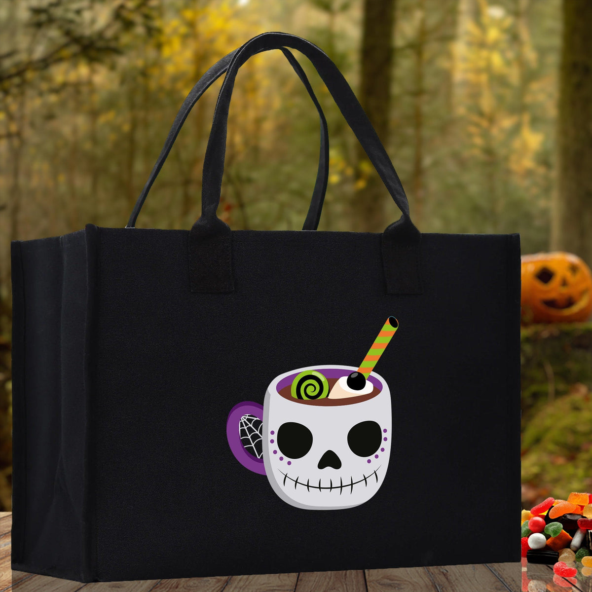 Black canvas Halloween tote bag for kids with smiling skull cup graphic and long handles