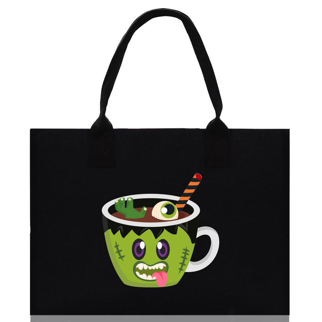 Black canvas tote bag with green monster potion cup Halloween graphic and double handles