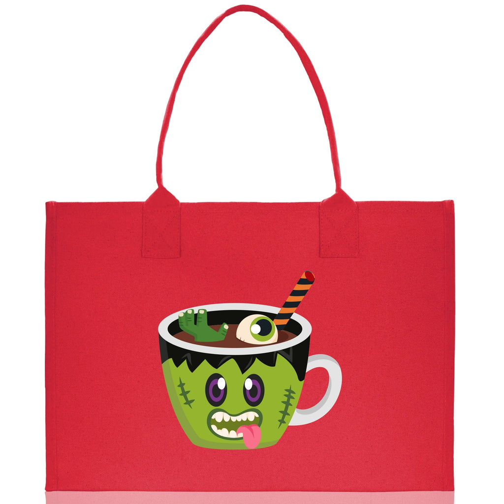 Red canvas tote bag with green monster potion cup Halloween graphic and double handles