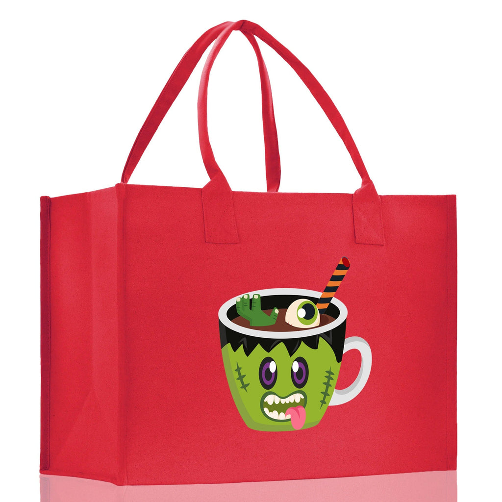 Red canvas tote bag with green monster potion cup Halloween graphic, wide side view