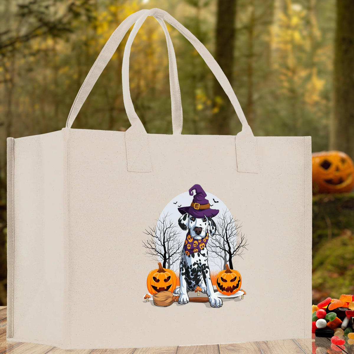 Natural canvas tote bag with cartoon witch dog and jack-o'-lanterns on the front.