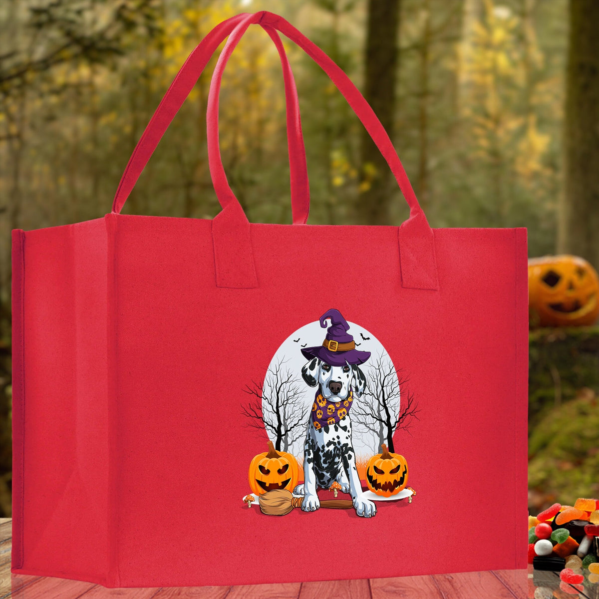 Red canvas tote bag with cartoon witch dog and jack-o'-lanterns on the front.