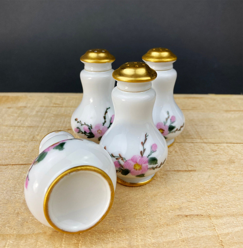 Porcelain spice shakers with gold lids and floral design