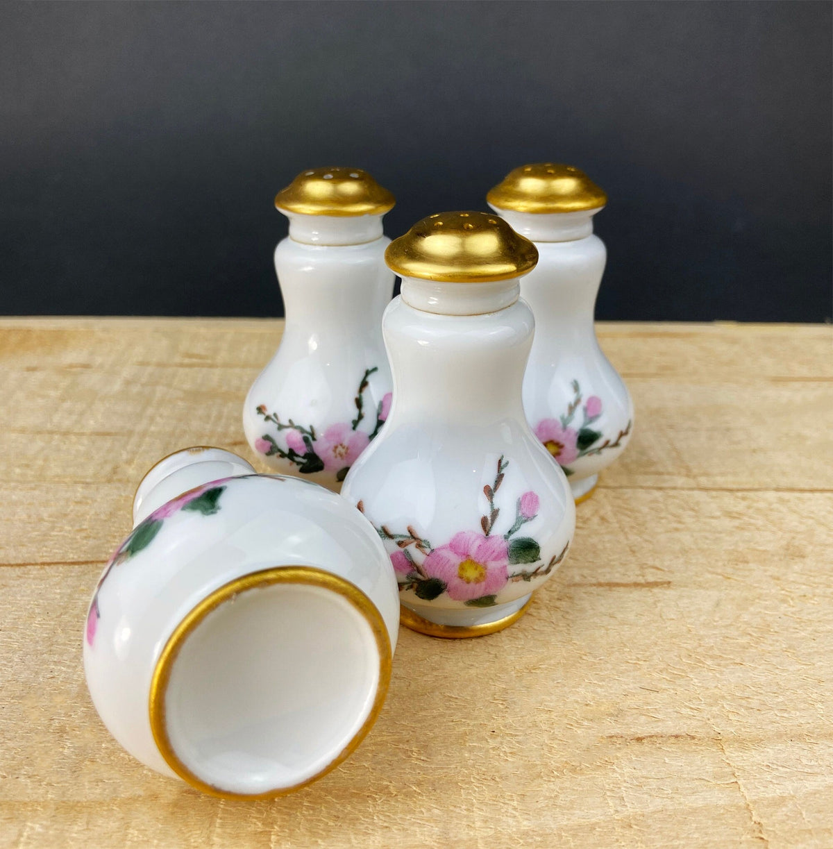 Porcelain spice shakers with gold lids and floral design