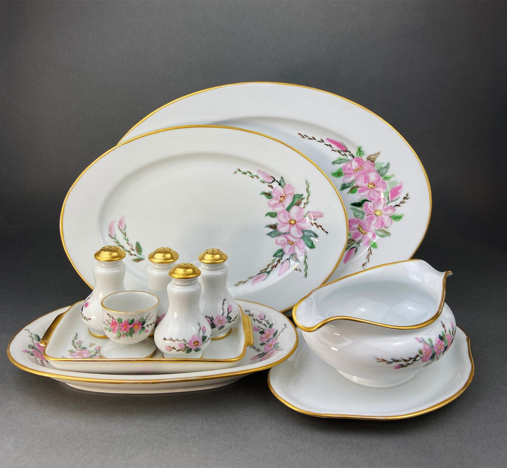 Porcelain serving set tray with oval platters, sauce boat, egg cup, and shakers
