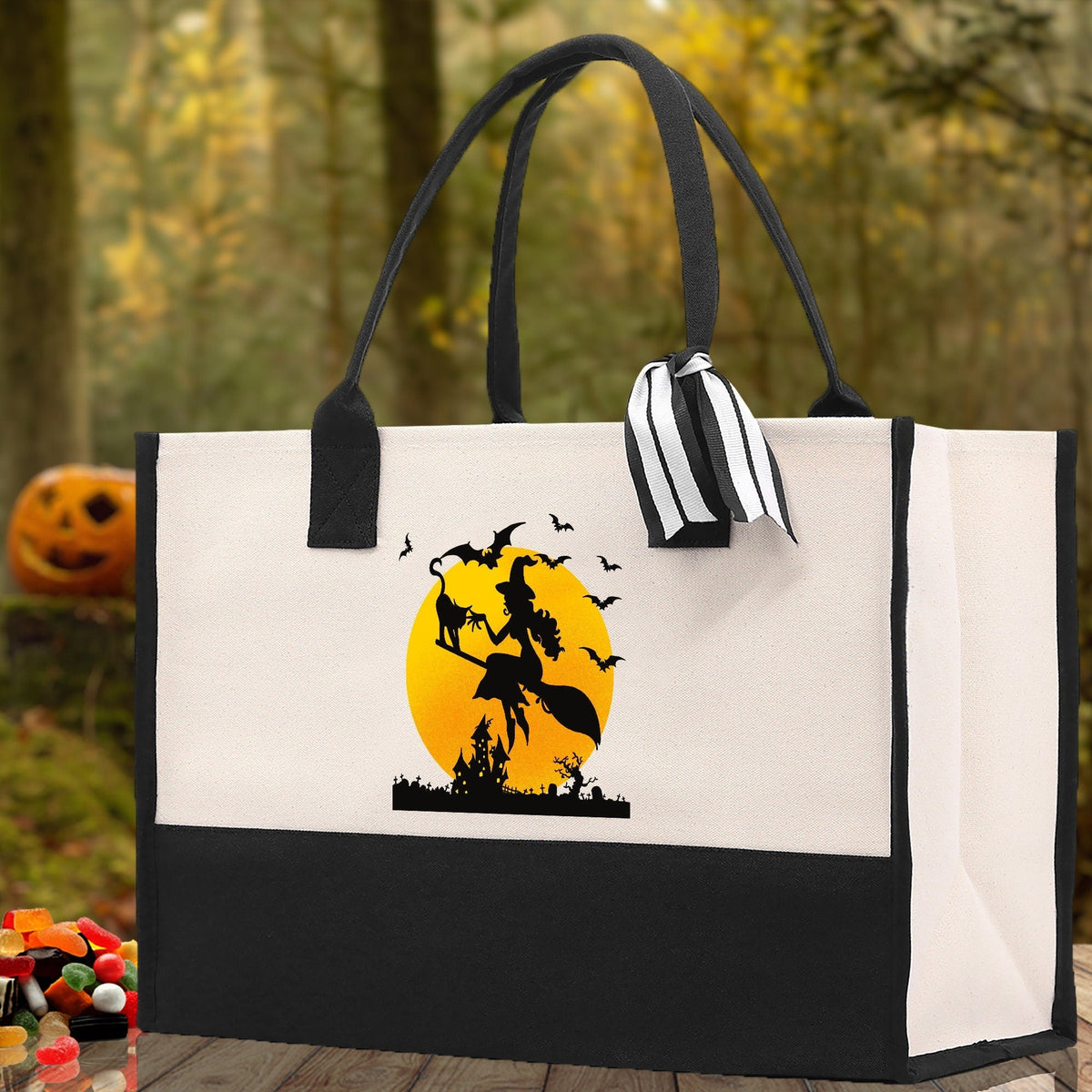 Canvas Halloween tote bag with witch silhouette graphic in yellow circle, black bottom panel
