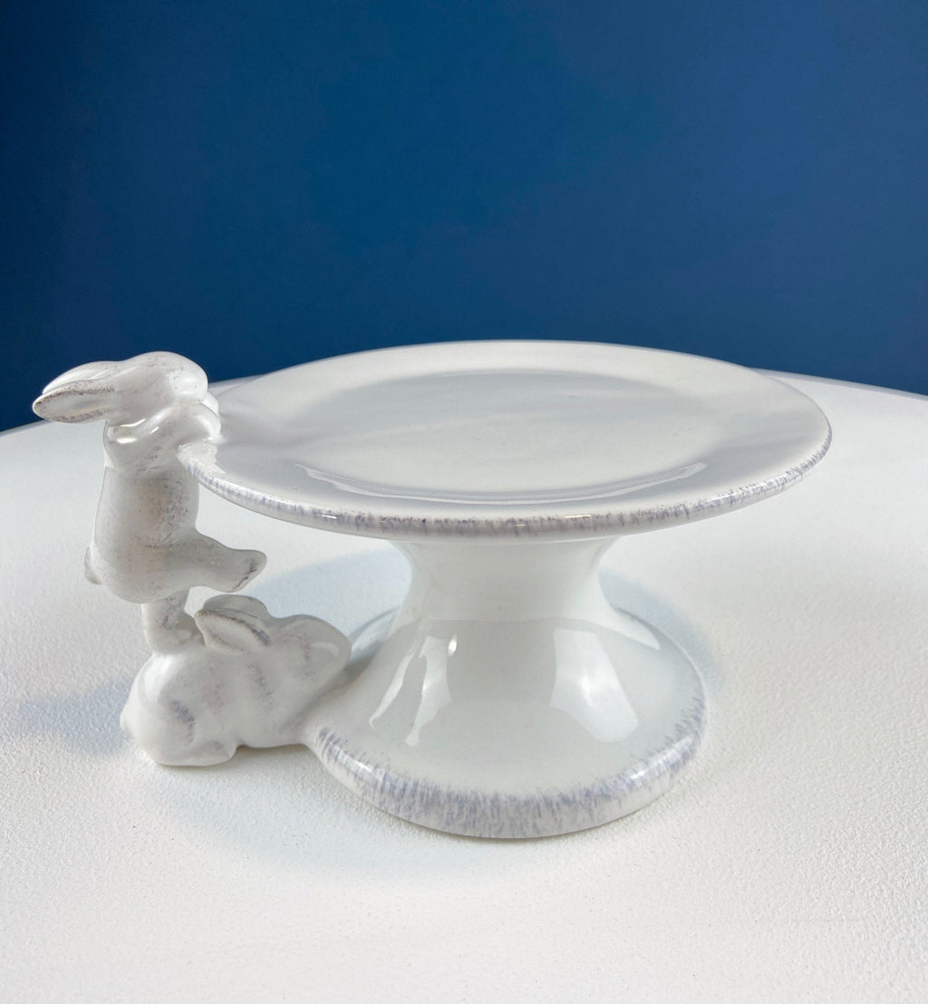 White ceramic rabbit cupcake stand with round plate and bunny climbing detail at side
