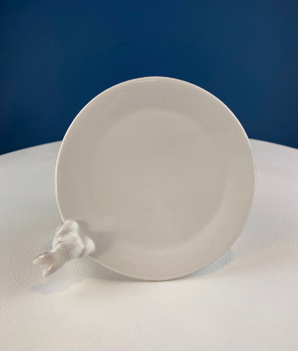 White ceramic round dish with bunny figurine on the side, for cupcake display