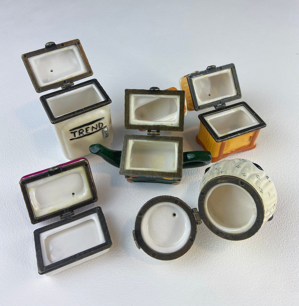 Miniature porcelain pill boxes, several hinged lids and bases with Trend label