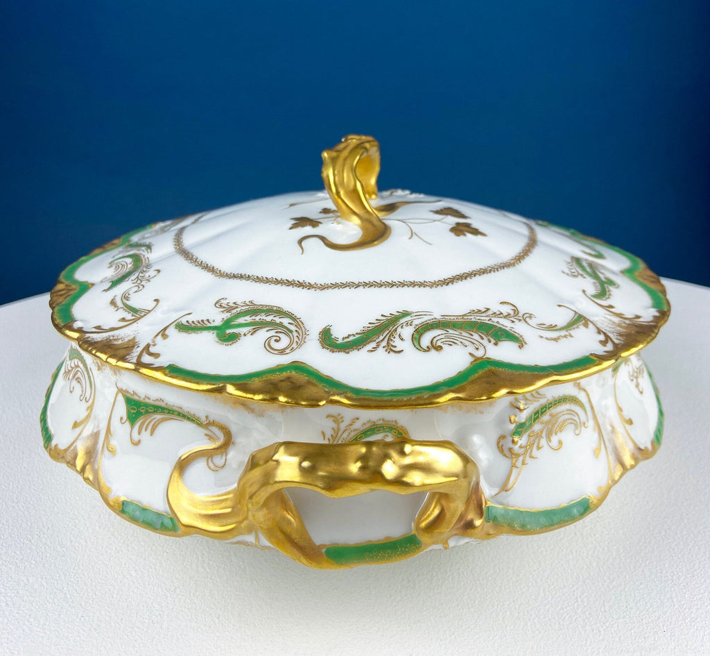 White porcelain tureen with gold trim, green wave accents, and central front decorative pull