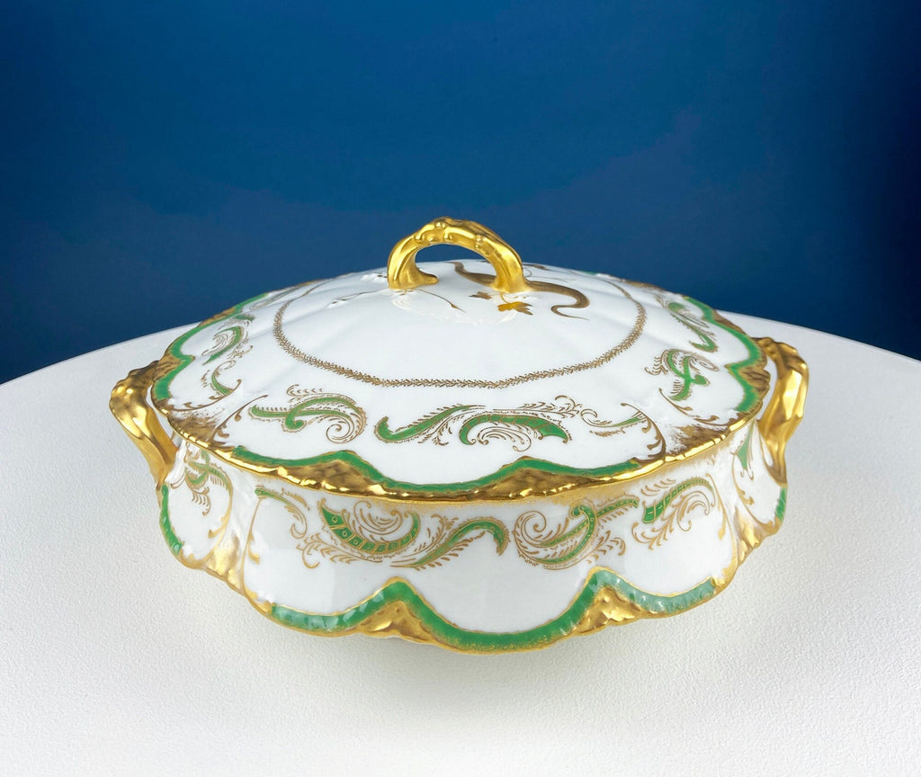White porcelain tureen with green and gold ornamental trim and raised lid handle