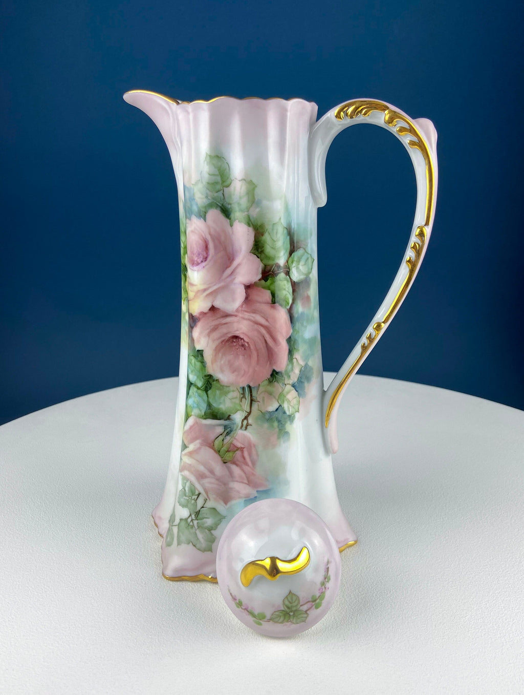 Porcelain hot chocolate pot with gold-trimmed spout and pink rose bouquet painting