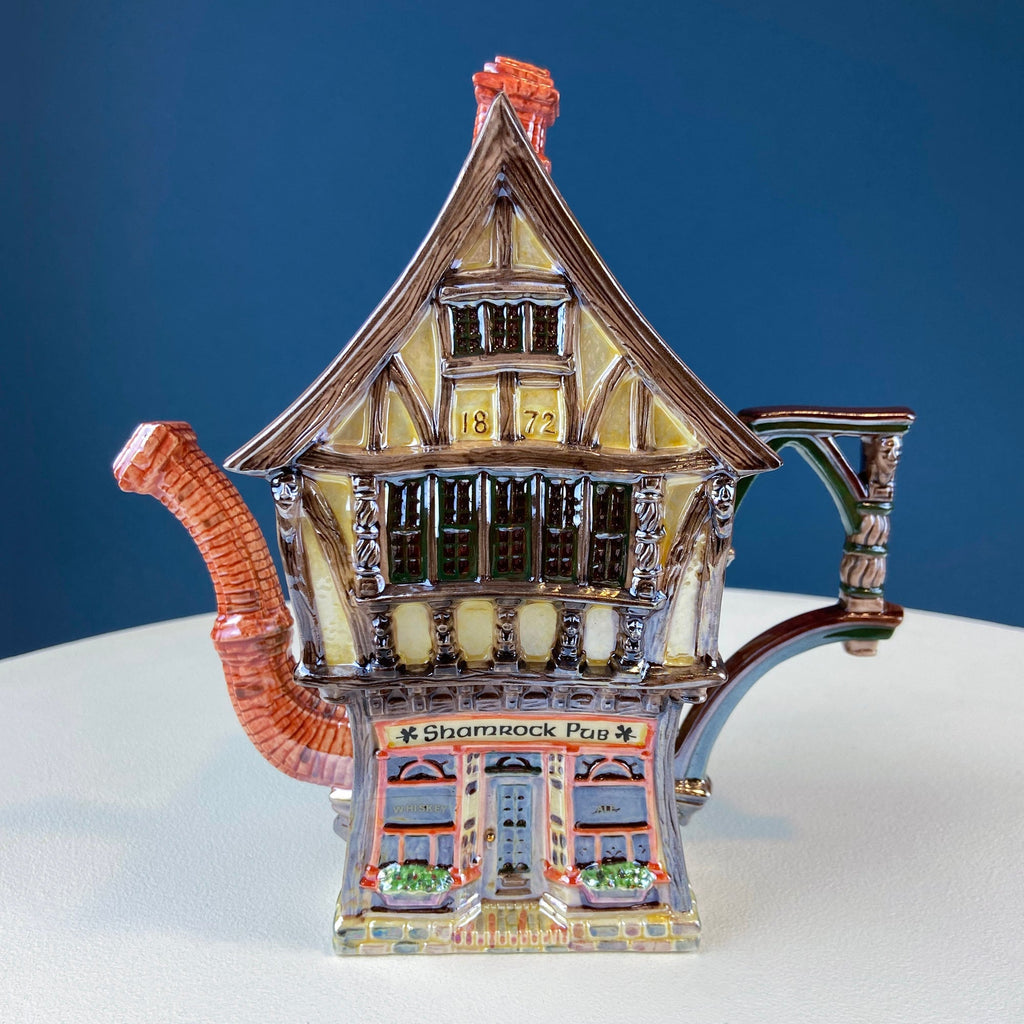 Toy-style house-shaped ceramic pub building with lantern roof details