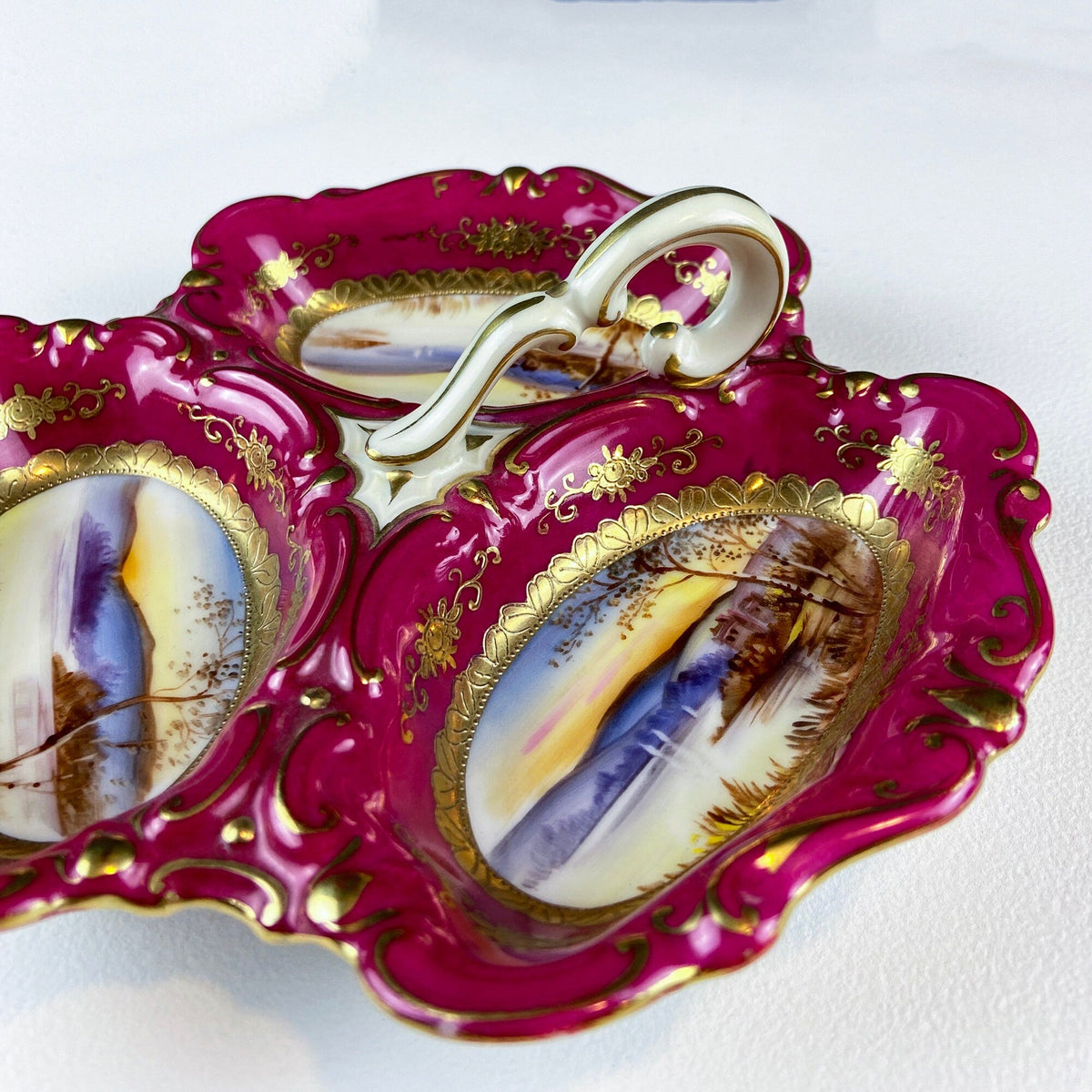 Porcelain divided bowl detail with handle, magenta glaze and gold floral ornament